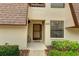 Condo building exterior with walkway and landscaping at 4576 Ringwood Mdw # 5, Sarasota, FL 34235