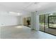 Bright living room with sliding glass doors leading to a patio at 4576 Ringwood Mdw # 5, Sarasota, FL 34235