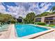 Refreshing community pool with plenty of lounge chairs at 4576 Ringwood Mdw # 5, Sarasota, FL 34235
