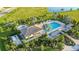Community pool with a cabana, hot tub, and lounge chairs at 27460 Janzen Ct, Englewood, FL 34223