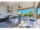 Outdoor kitchen and dining area near the pool at 27460 Janzen Ct, Englewood, FL 34223