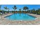 Inviting community pool with lounge chairs at 27460 Janzen Ct, Englewood, FL 34223