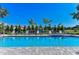 Sparkling community pool with plenty of seating at 27460 Janzen Ct, Englewood, FL 34223