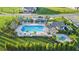 Community pool and spa with surrounding landscaping at 27460 Janzen Ct, Englewood, FL 34223