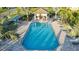 Community pool with plenty of lounge chairs and a cabana at 27460 Janzen Ct, Englewood, FL 34223