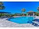 Large community pool with plenty of lounge chairs at 27460 Janzen Ct, Englewood, FL 34223