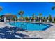 Resort-style pool with shaded seating at 27460 Janzen Ct, Englewood, FL 34223
