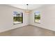 Dining room with large windows and a view of the pool at 196 Arch Dr, Rotonda West, FL 33947