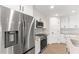 Modern kitchen with stainless steel refrigerator and built-in microwave at 196 Arch Dr, Rotonda West, FL 33947
