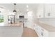 Spacious kitchen with stainless steel appliances and granite countertops at 196 Arch Dr, Rotonda West, FL 33947
