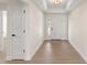 Bright entryway with wood-look tile flooring and neutral walls at 196 Arch Dr, Rotonda West, FL 33947