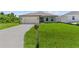 Newly built home with a two-car garage and driveway at 196 Arch Dr, Rotonda West, FL 33947
