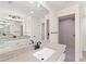 Elegant bathroom with double vanity, granite countertop and a shower at 196 Arch Dr, Rotonda West, FL 33947