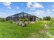 Single-story house with attached garage and a neatly landscaped lawn at 196 Arch Dr, Rotonda West, FL 33947