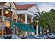 Evening view of a town square with shops and restaurants at 771 John Ringling Blvd # 22Fair, Sarasota, FL 34236
