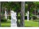 Classic sculptures amidst lush greenery in a park at 771 John Ringling Blvd # 22Fair, Sarasota, FL 34236
