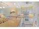 Kitchen features granite countertops, white cabinets, and a breakfast bar at 771 John Ringling Blvd # 22Fair, Sarasota, FL 34236