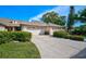 Charming single-story home with a two-car garage, well-maintained lawn, and lovely curb appeal at 4115 Putter Pl # 4115, Bradenton, FL 34203