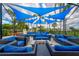 Outdoor patio furniture under blue shade sails at 4115 Putter Pl # 4115, Bradenton, FL 34203
