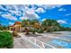 Golf cart and car parking area with landscaping at 4115 Putter Pl # 4115, Bradenton, FL 34203