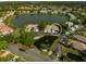 Aerial view showcasing home's location in a community by a lake at 4115 Putter Pl # 4115, Bradenton, FL 34203