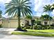 Beautiful two-story house with palm trees and lush landscaping at 14708 Sundial Pl, Lakewood Ranch, FL 34202