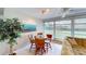 Bright dining area with table and chairs, offering view of backyard at 7150 W Country Club N Dr, Sarasota, FL 34243