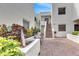 Building exterior with stairs and landscaping at 5188 Marsh Field Ln # 93, Sarasota, FL 34235