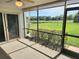 Spacious screened patio overlooking a lush green golf course at 5188 Marsh Field Ln # 93, Sarasota, FL 34235