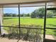 Peaceful screened patio overlooking a lush green golf course at 5188 Marsh Field Ln # 93, Sarasota, FL 34235