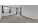 Bright bedroom with sliding door to balcony, ceiling fan and neutral decor at 5188 Marsh Field Ln # 93, Sarasota, FL 34235