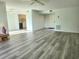 Open living area with wood-look floors and views into kitchen at 5188 Marsh Field Ln # 93, Sarasota, FL 34235