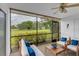 Relaxing screened patio with outdoor furniture and golf course view at 5188 Marsh Field Ln # 93, Sarasota, FL 34235