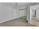 Bedroom with mirrored closet and access to hallway at 5188 Marsh Field Ln # 93, Sarasota, FL 34235