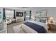 Spacious bedroom with large bed, TV, and access to balcony at 5188 Marsh Field Ln # 93, Sarasota, FL 34235