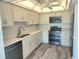 Modern kitchen with white cabinets, quartz countertops, and stainless steel appliances at 5188 Marsh Field Ln # 93, Sarasota, FL 34235