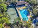 Aerial view of tennis court and swimming pool at 5188 Marsh Field Ln # 93, Sarasota, FL 34235