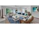 Living room with wicker furniture and blue accents at 5188 Marsh Field Ln # 93, Sarasota, FL 34235