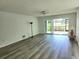 Bright living room with sliding doors leading to a patio and golf course views at 5188 Marsh Field Ln # 93, Sarasota, FL 34235