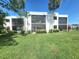 Building exterior with green lawn at 5188 Marsh Field Ln # 93, Sarasota, FL 34235