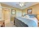 Queen-size bed, dresser, and access to a hallway bathroom at 625 30Th W Ave # G403, Bradenton, FL 34205