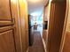 View down a hallway shows the kitchen and living area beyond at 3333 26Th E Ave # 1244, Bradenton, FL 34208