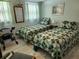 Cozy bedroom with two twin beds and light colored bedding at 3333 26Th E Ave # 1244, Bradenton, FL 34208