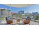 Balcony seating area with city views on a sunny day at 1771 Ringling Blvd # 604, Sarasota, FL 34236