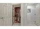 Walk-in closet with built-in shelving at 1771 Ringling Blvd # 604, Sarasota, FL 34236