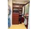 Walk-in closet with custom wood shelving and ample storage space at 1771 Ringling Blvd # 604, Sarasota, FL 34236
