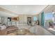 Open living room with a view to the kitchen and balcony at 1771 Ringling Blvd # 604, Sarasota, FL 34236