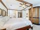 Large main bedroom with a wooden canopy bed and ample closet space at 8678 Rain Song Rd, Sarasota, FL 34238