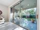 Sliding glass doors reveal a private backyard patio at 8678 Rain Song Rd, Sarasota, FL 34238