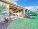 Covered patio with sliding glass doors leading to the interior at 8678 Rain Song Rd, Sarasota, FL 34238